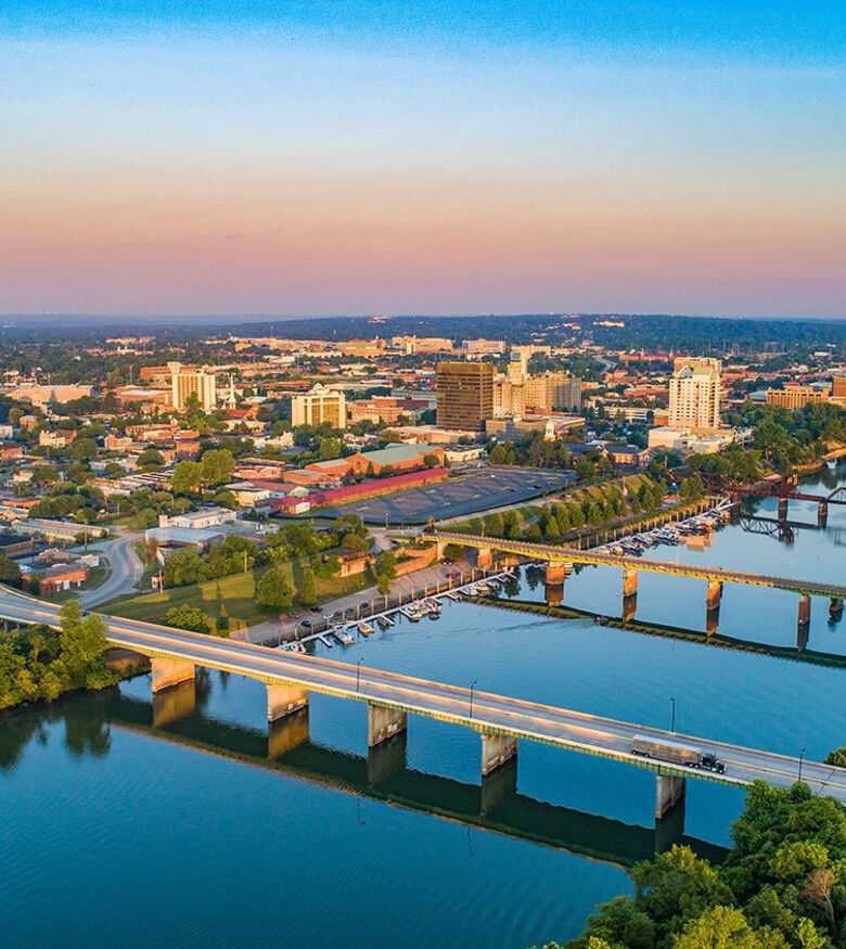 Augusta cityscape at twilight with the Savannah River, safeguarded by the commitment of local personal injury lawyers.