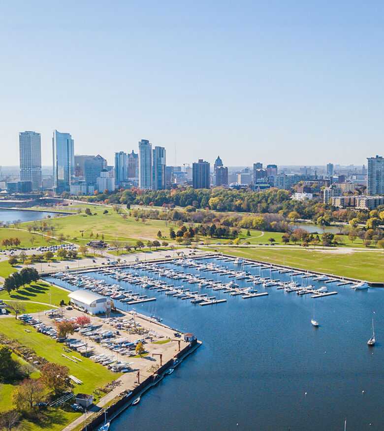 Aerial view of Milwaukee's lakeside skyline and marina on a clear day, ideal for personal injury lawyers.