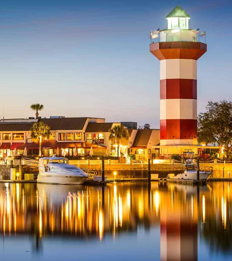 Hilton Head lighthouse and marina at dusk, reflecting the guiding presence of personal injury lawyers in the area.