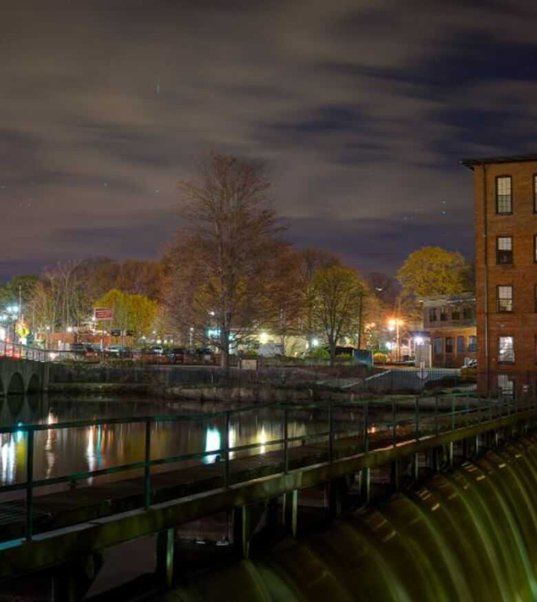 Night view of Waltham's serene riverside, a locale for personal injury lawyers in Waltham.