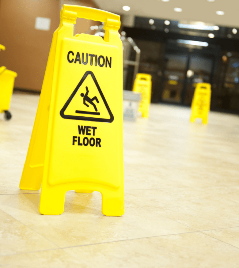 Premises Liability and Slip & Fall Lawyers - Slippery Floor sign